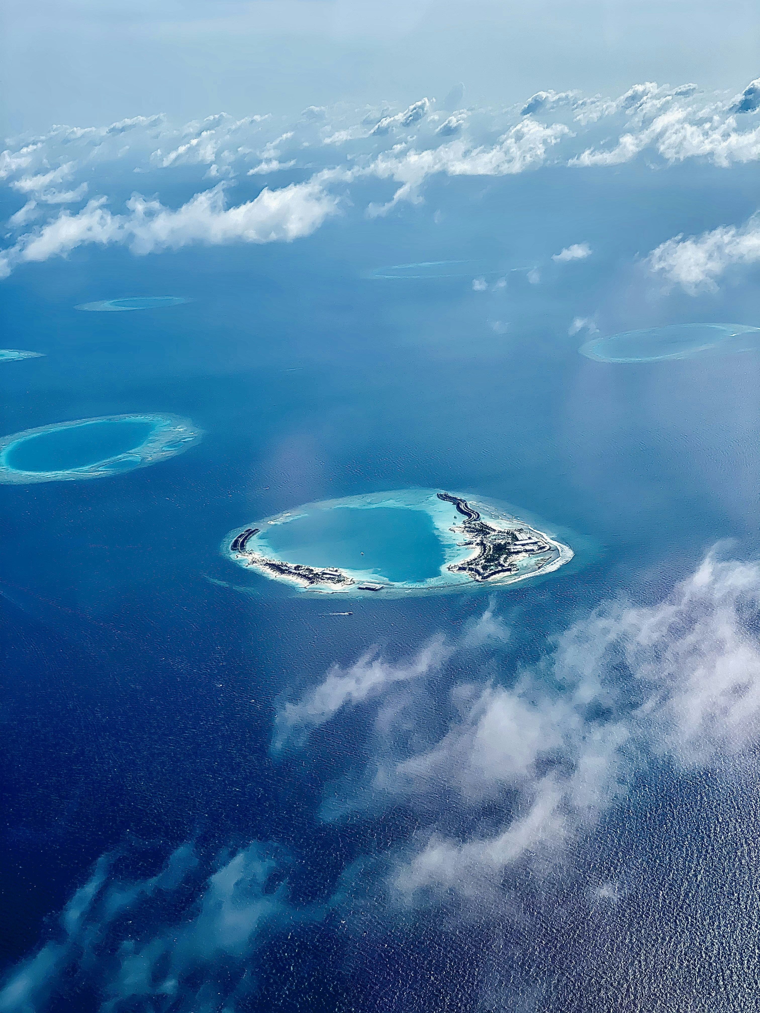 aerial view of island under blue sky