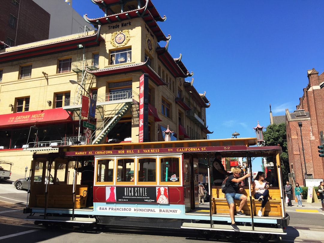 people riding on tram during daytime