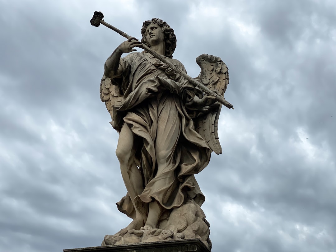 man holding a sword statue