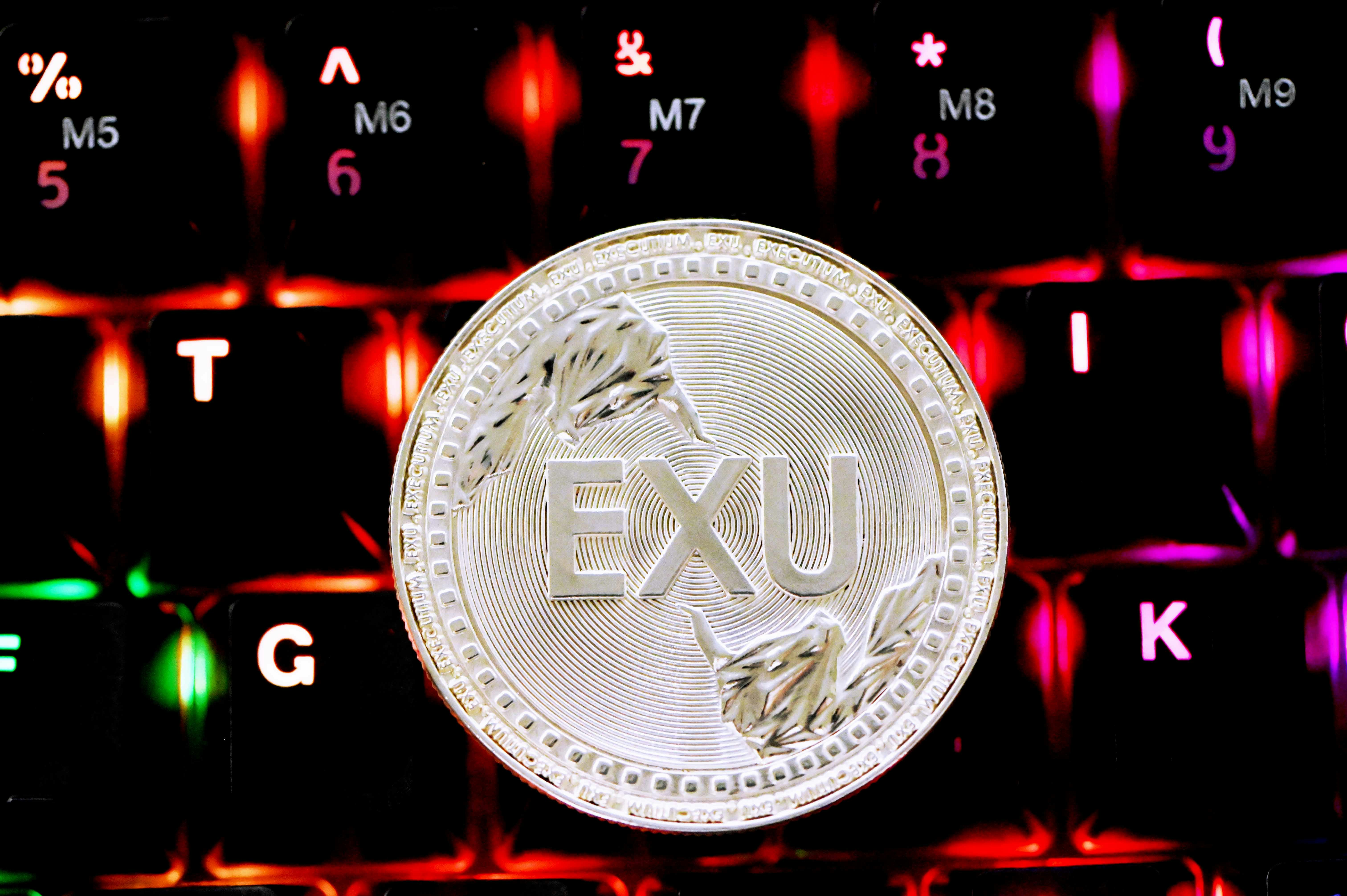 round silver coin on black surface