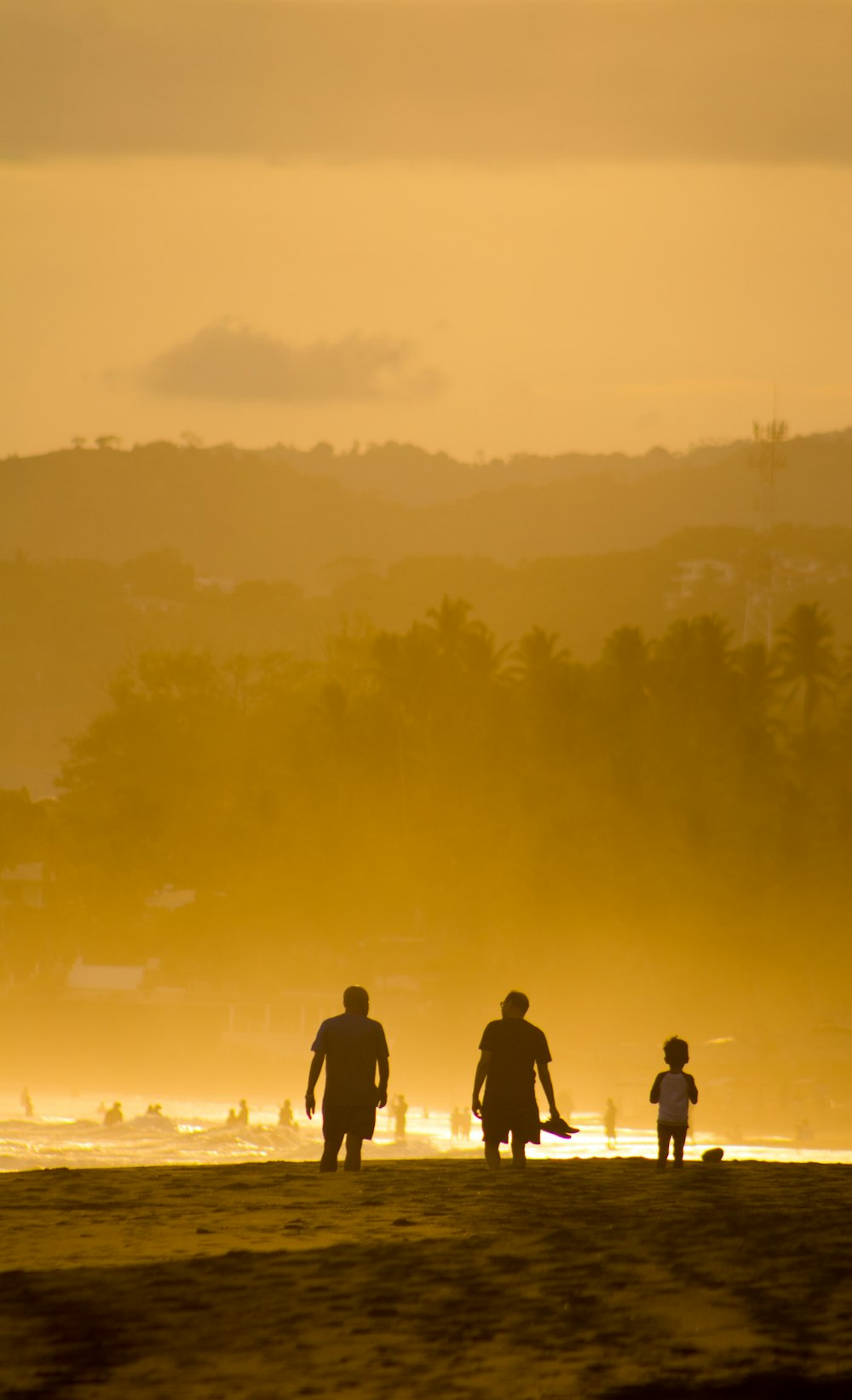 silhouette of people standing on field during daytime