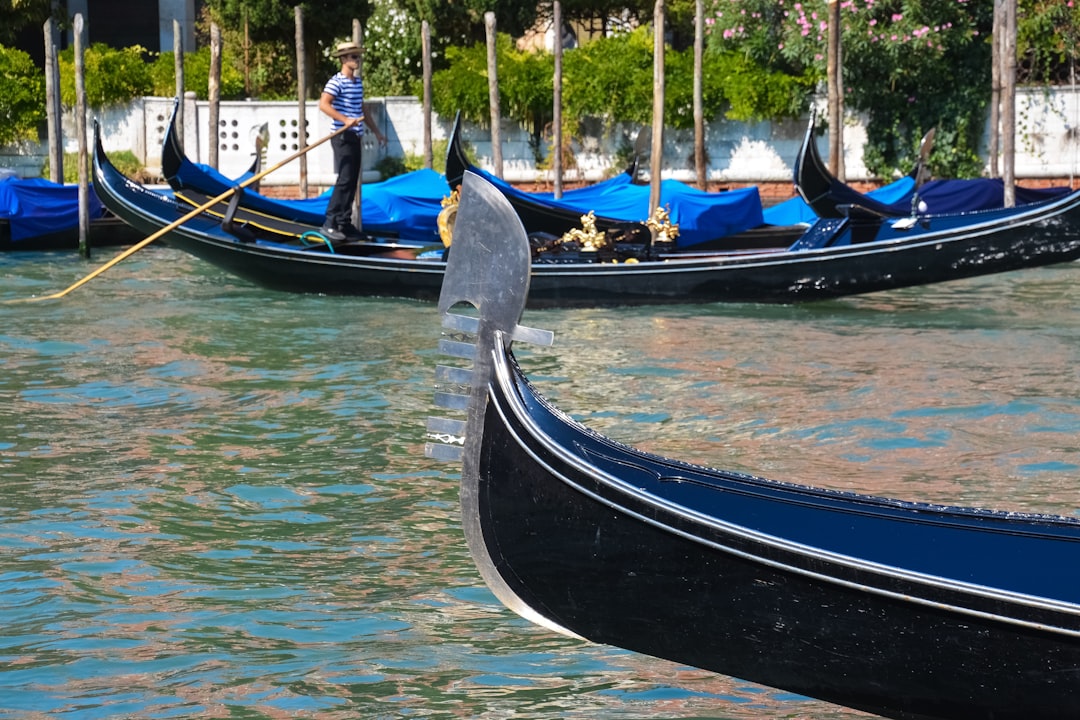 black and blue boat on water during daytime