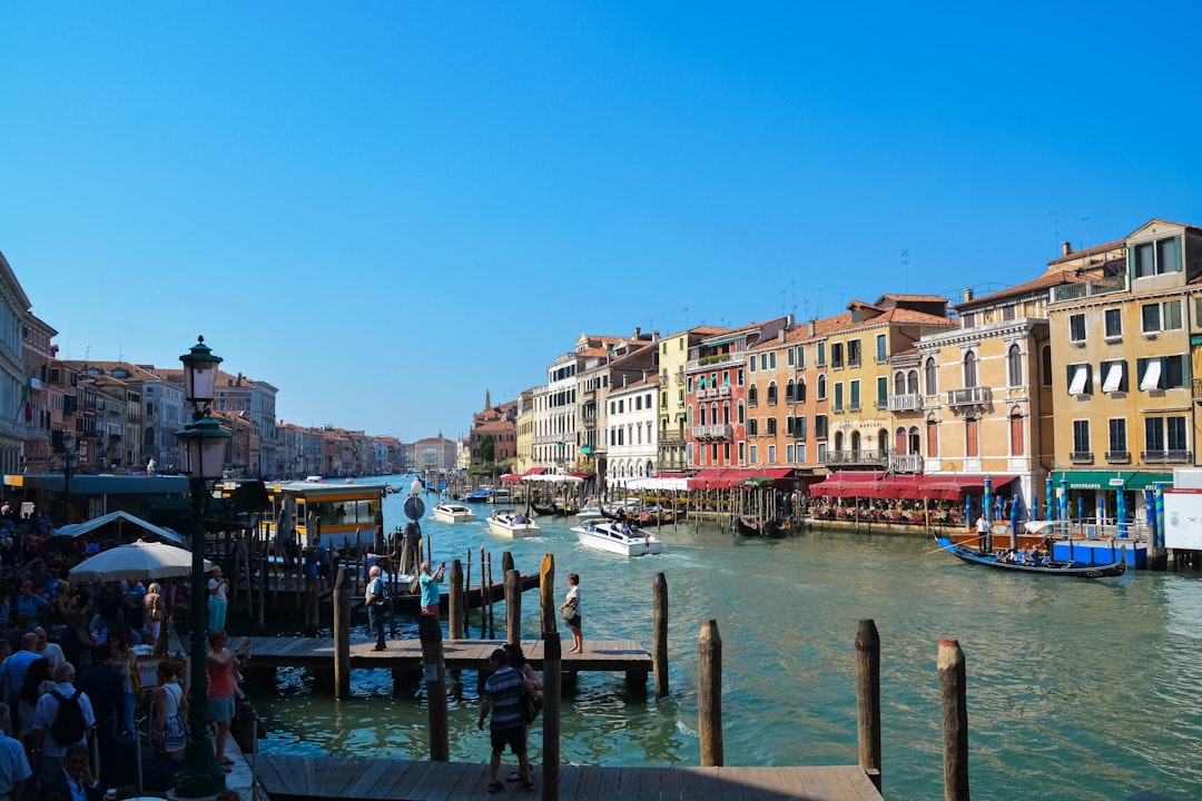 body of water between buildings during daytime