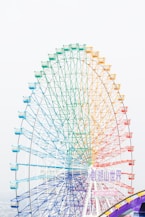 white ferris wheel under white sky during daytime