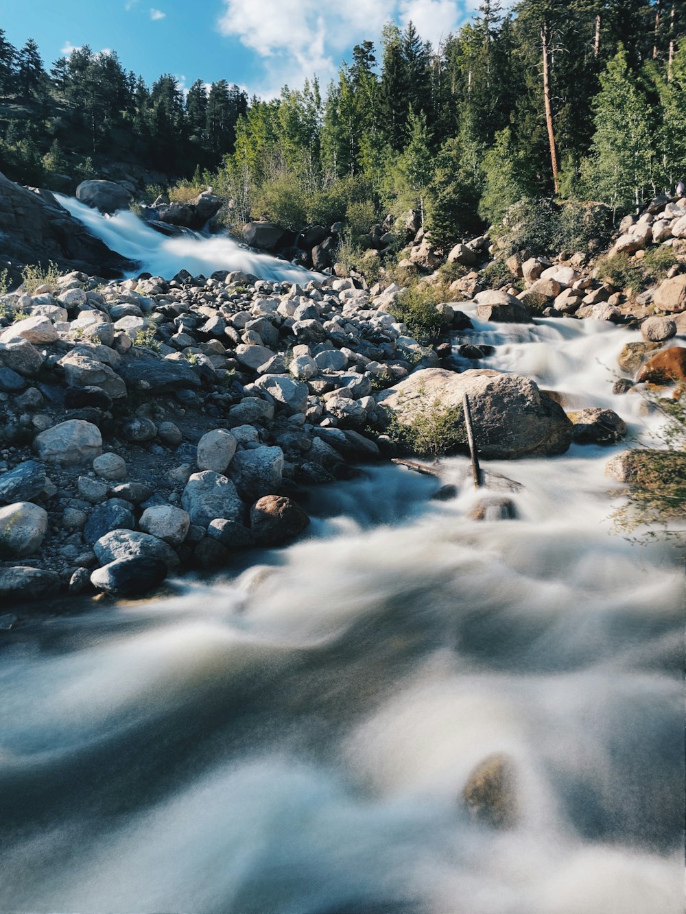 rocky river with rocks and trees