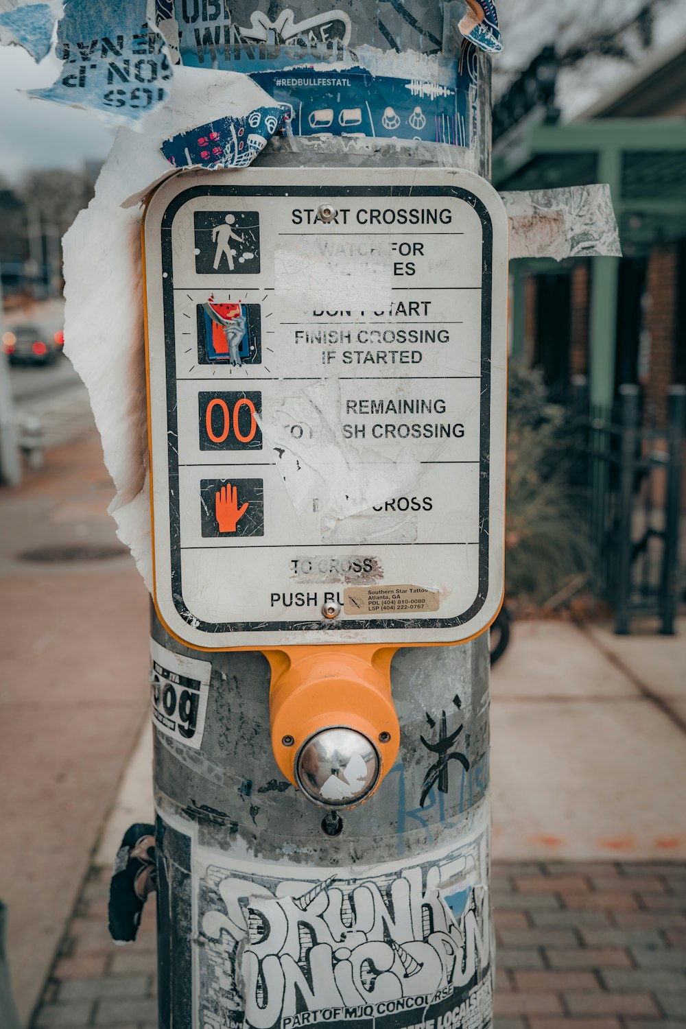 a close up of a parking meter with stickers on it