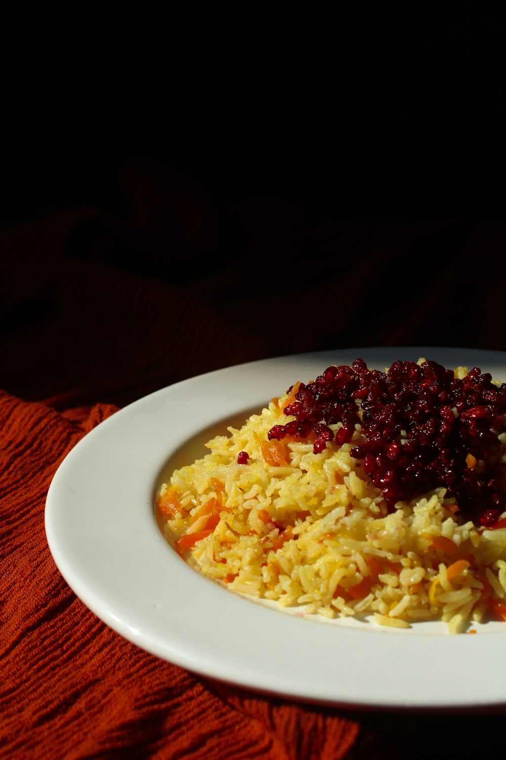 white ceramic plate with yellow rice