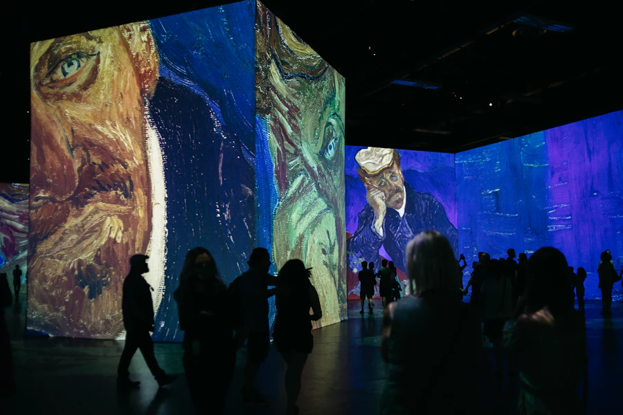 Visitors walking through a luminous blue art installation