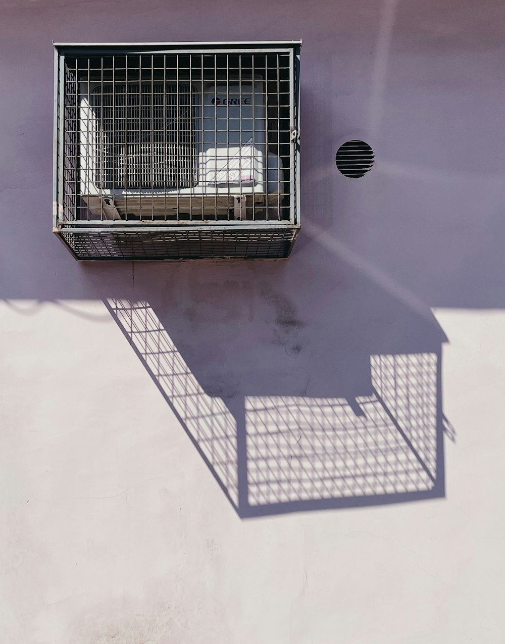 black metal pet cage on white table