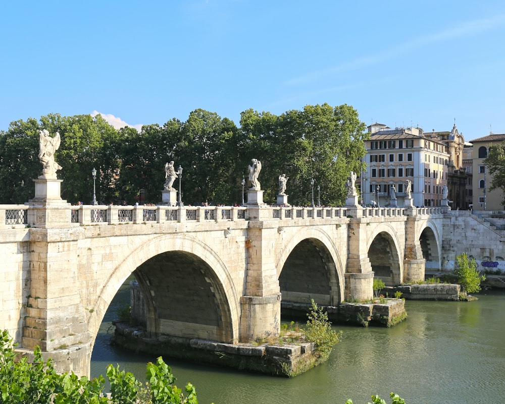 white concrete bridge over river during daytime