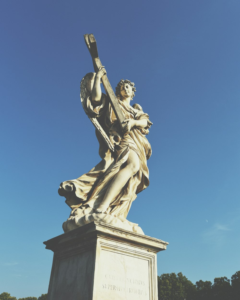 man holding a sword statue