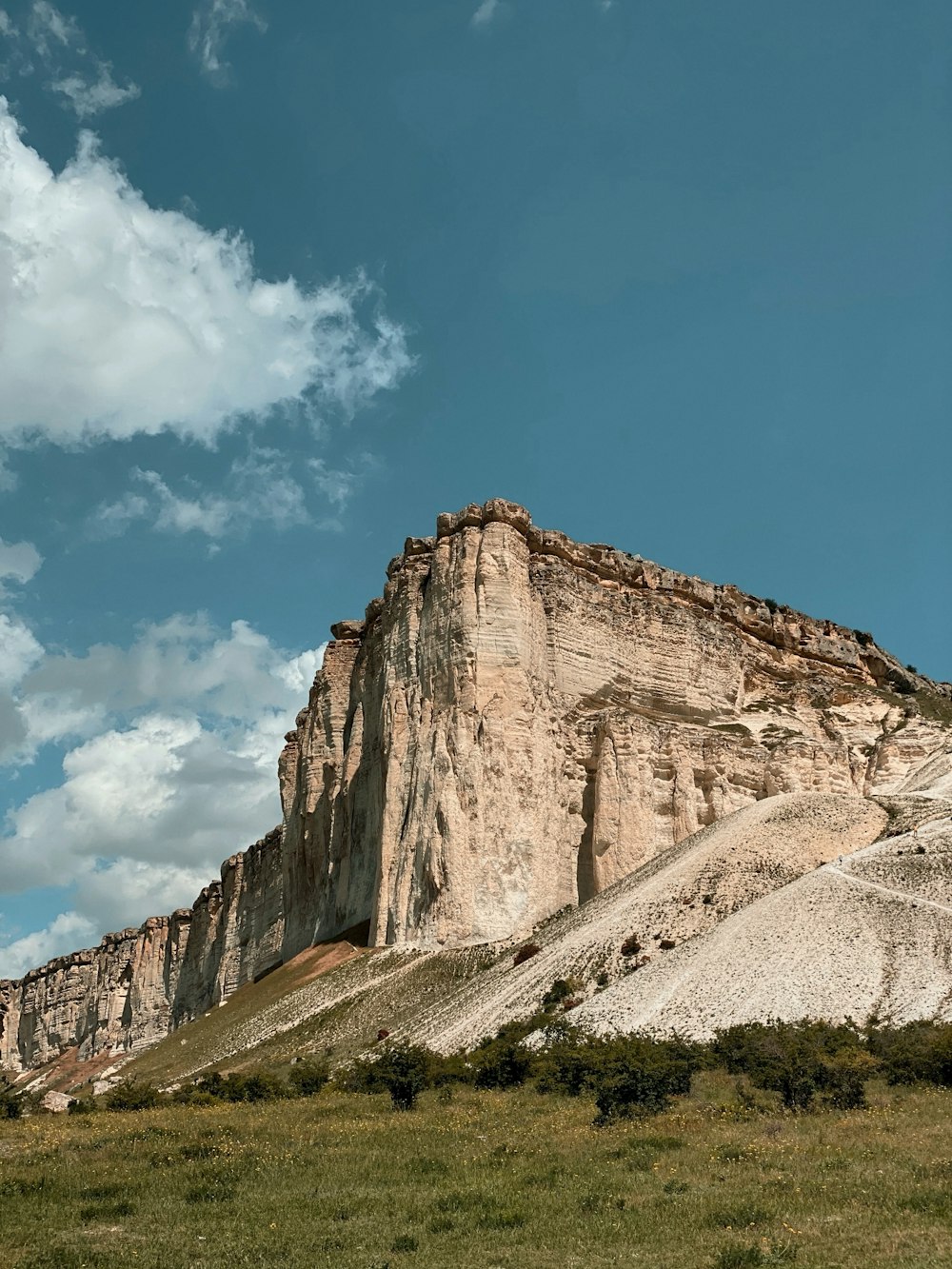 brown rocky mountain under blue sky during daytime