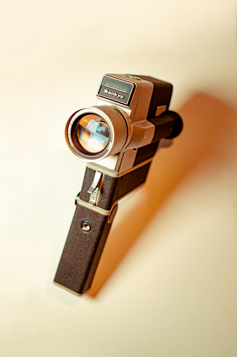 black and silver camera on white surface