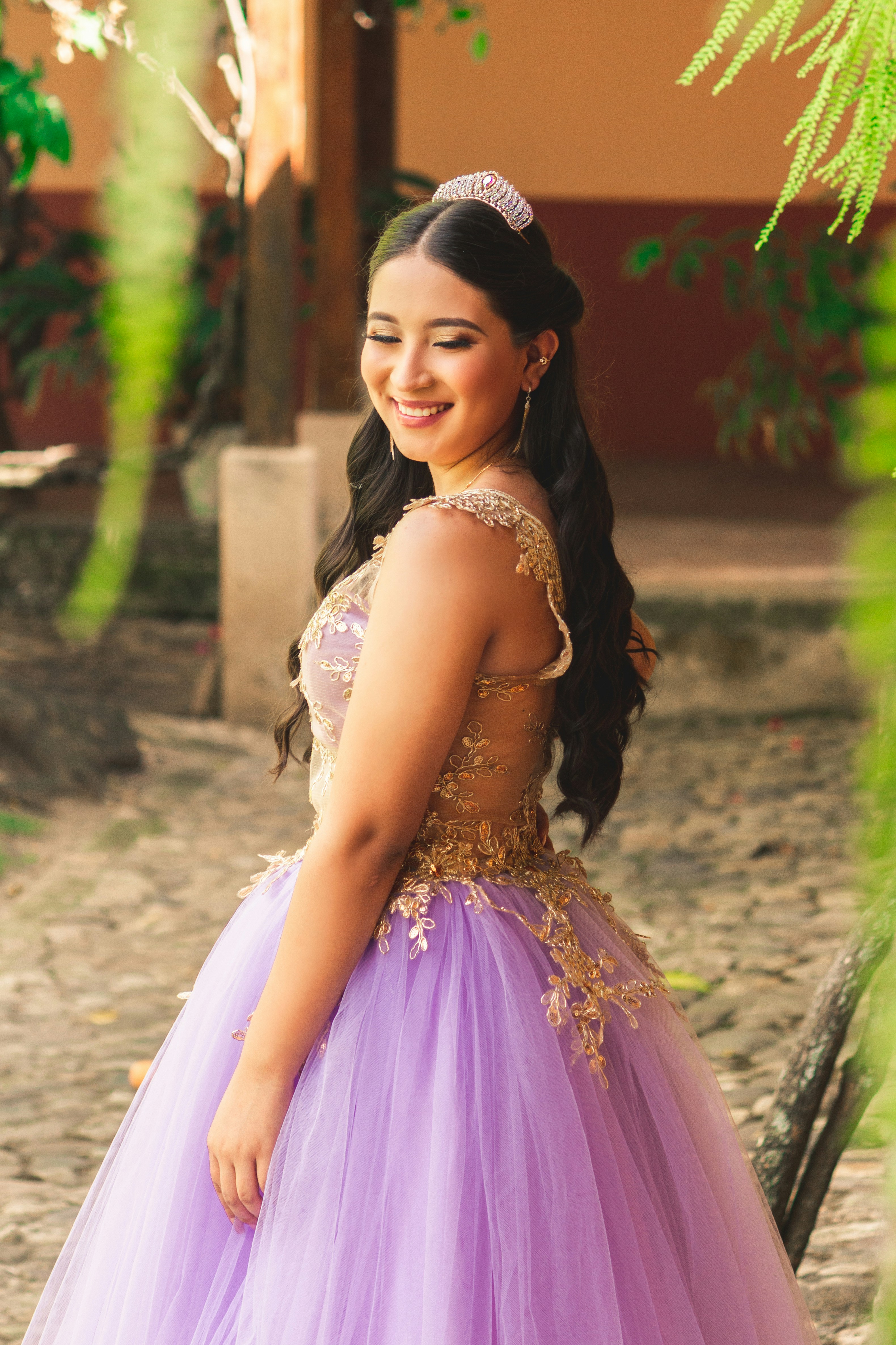woman in pink and gold floral dress