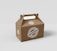 A brown cardboard box with a handle on top, featuring branding and the text 'GRUPOSEPAPEL'. The surface appears smooth with a seal-like logo and text in white.