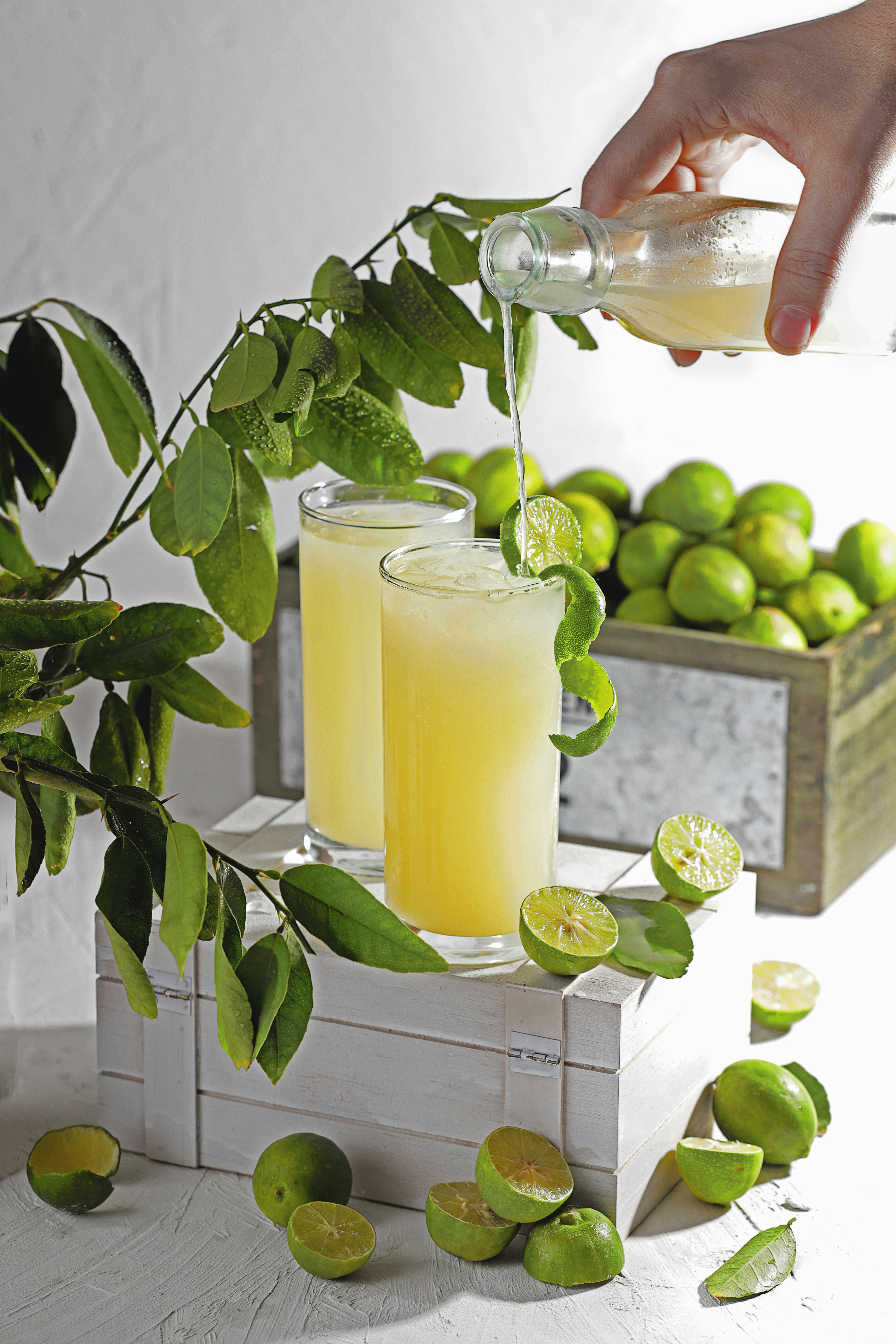 yellow juice in clear drinking glass