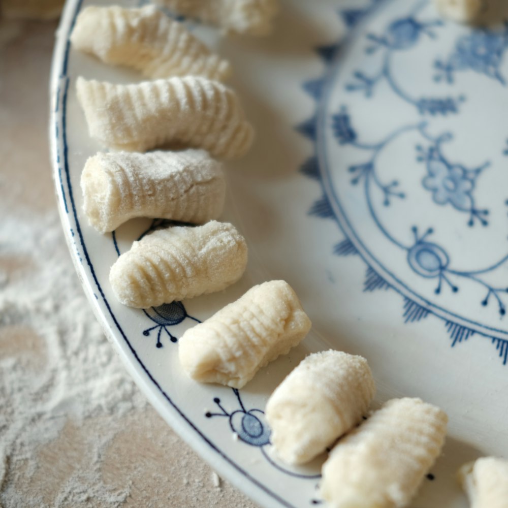 white and blue floral ceramic plate