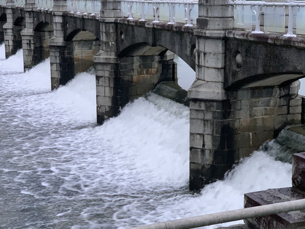 brown concrete bridge over water