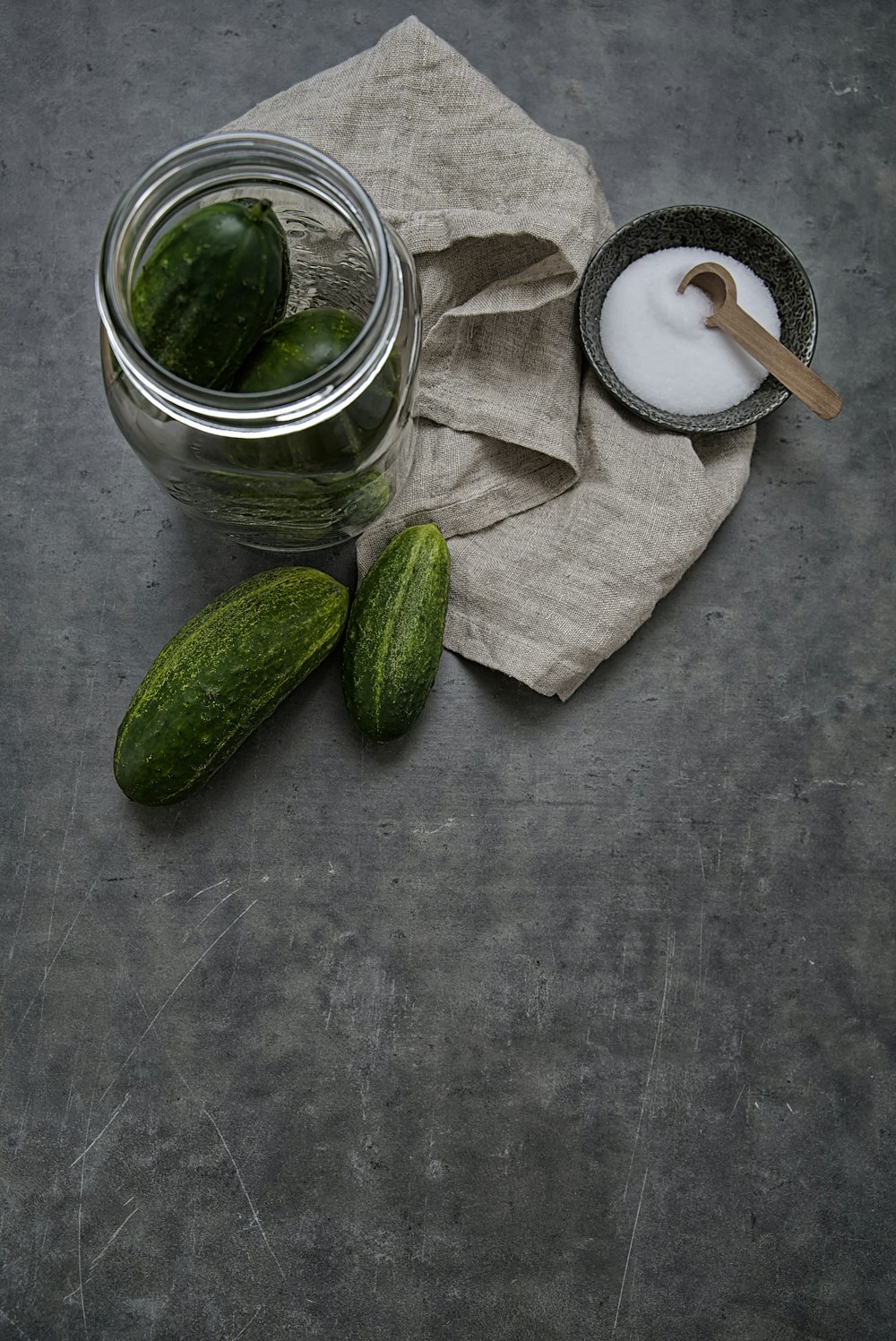 sliced cucumber in clear glass jar