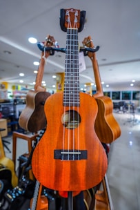 A cheerful ukulele lesson with students participating.