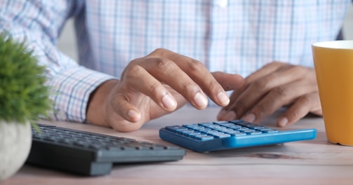 person using black computer keyboard