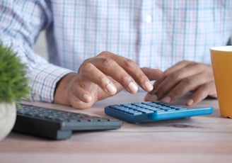 person using black computer keyboard