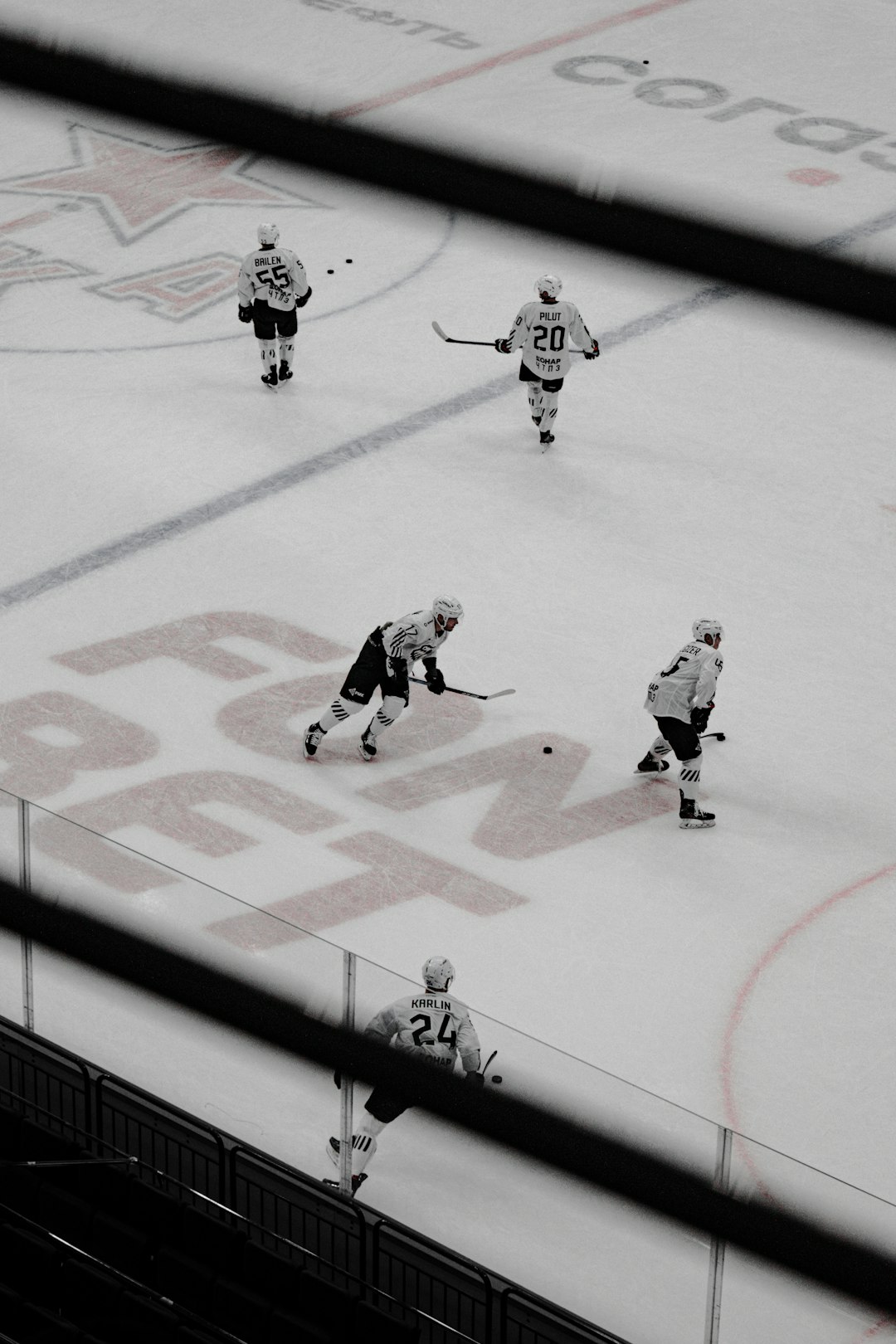 people playing ice hockey on field