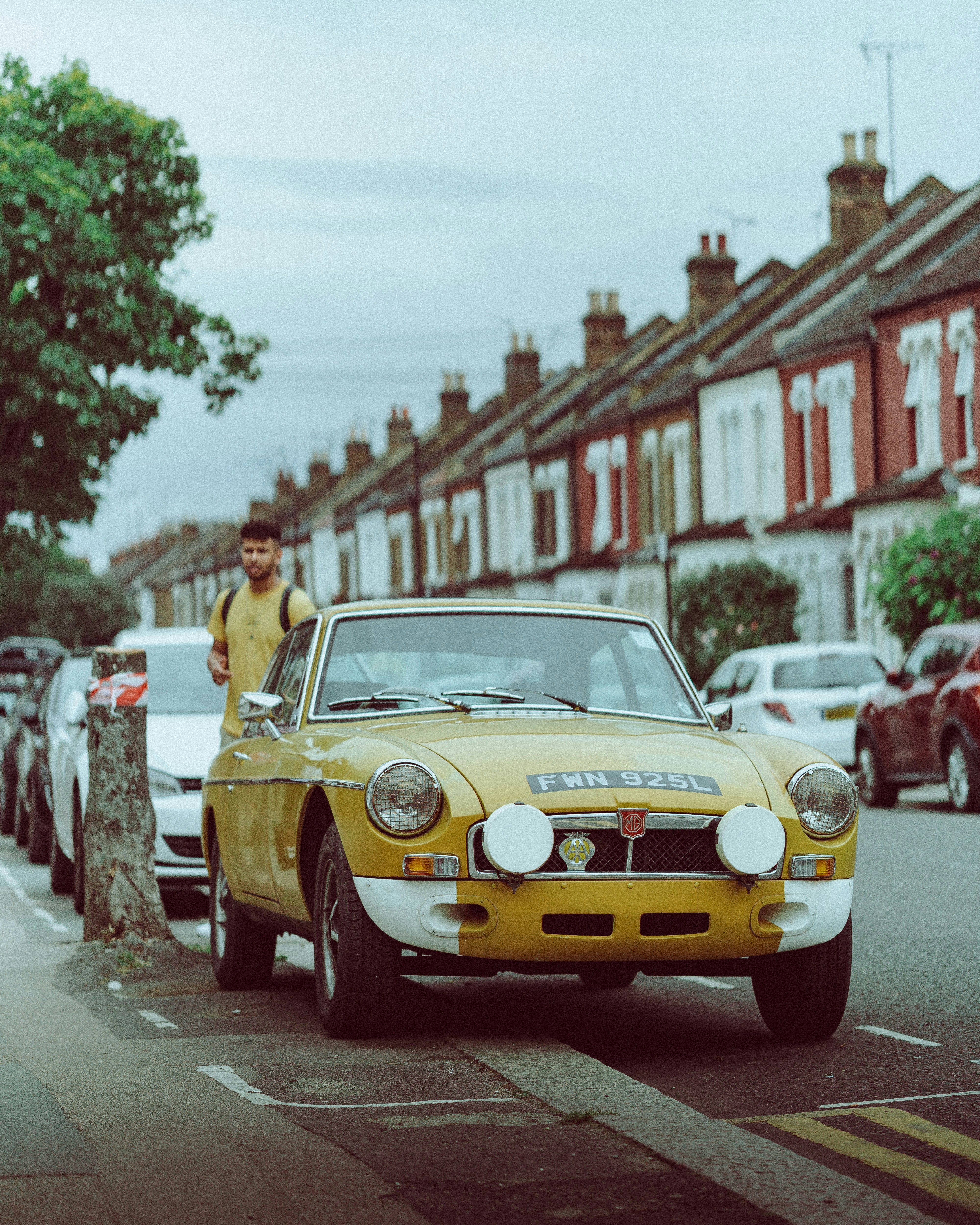 yellow porsche 911 on road during daytime