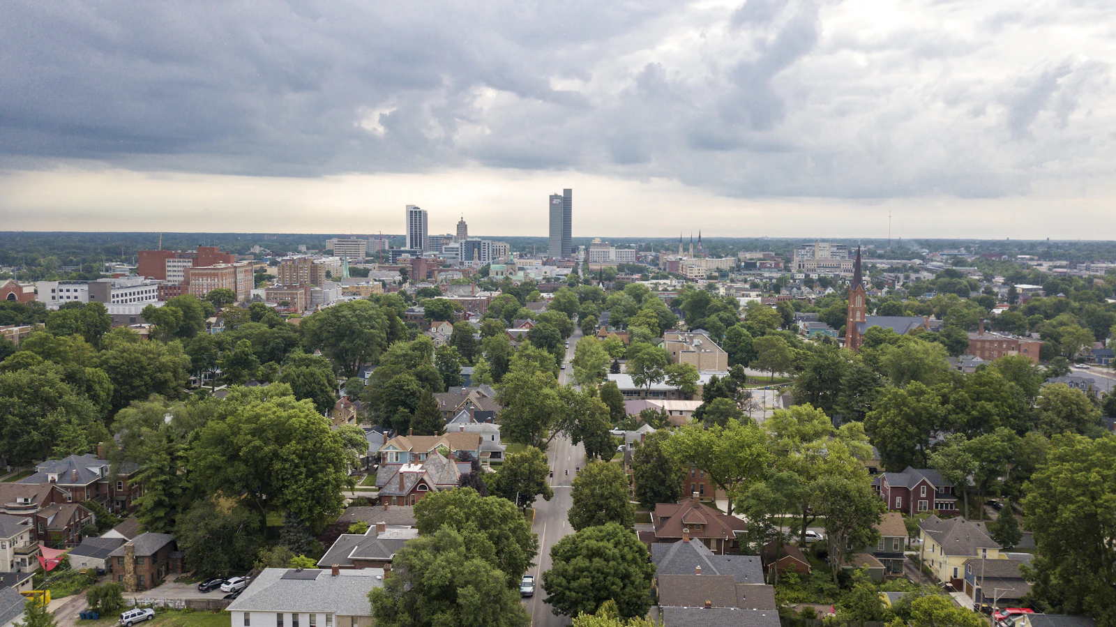 Aerial view of a downtown American cityscape under a dramatic sky
