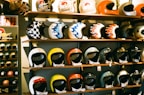 A collection of motorcycle helmets and gear arranged neatly.