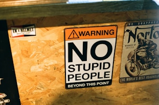 a sign that says no stupid people beyond this point