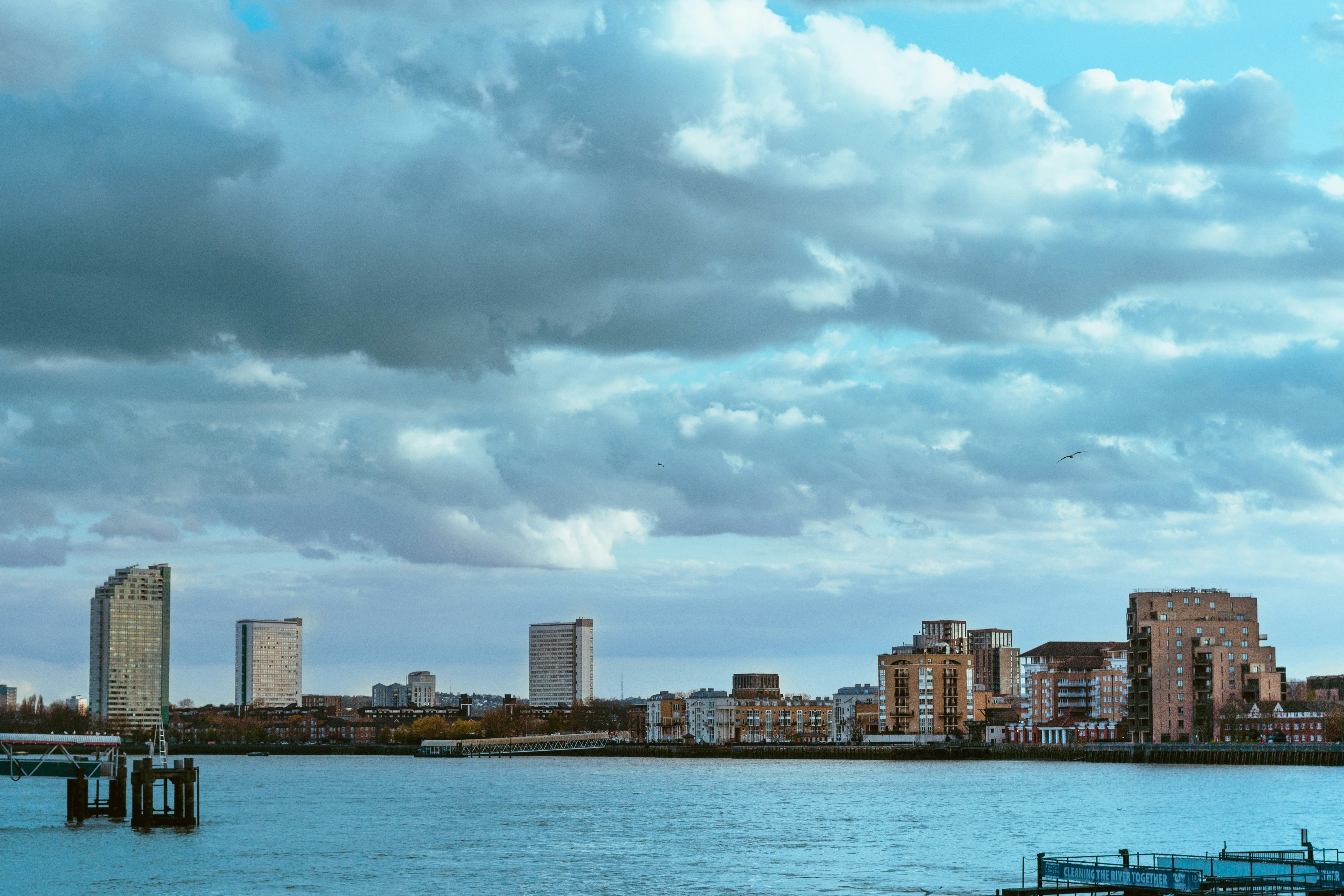 city skyline under cloudy sky during daytime