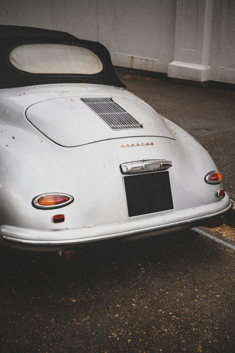 white porsche 911 parked on parking lot during night time