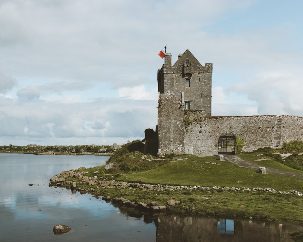 gray concrete building near body of water during daytime