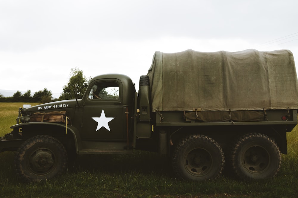 black and brown battle tank on green grass field during daytime