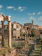 Ancient Roman ruins and the Colosseum under a blue sky in Rome