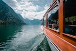 brown boat on body of water during daytime