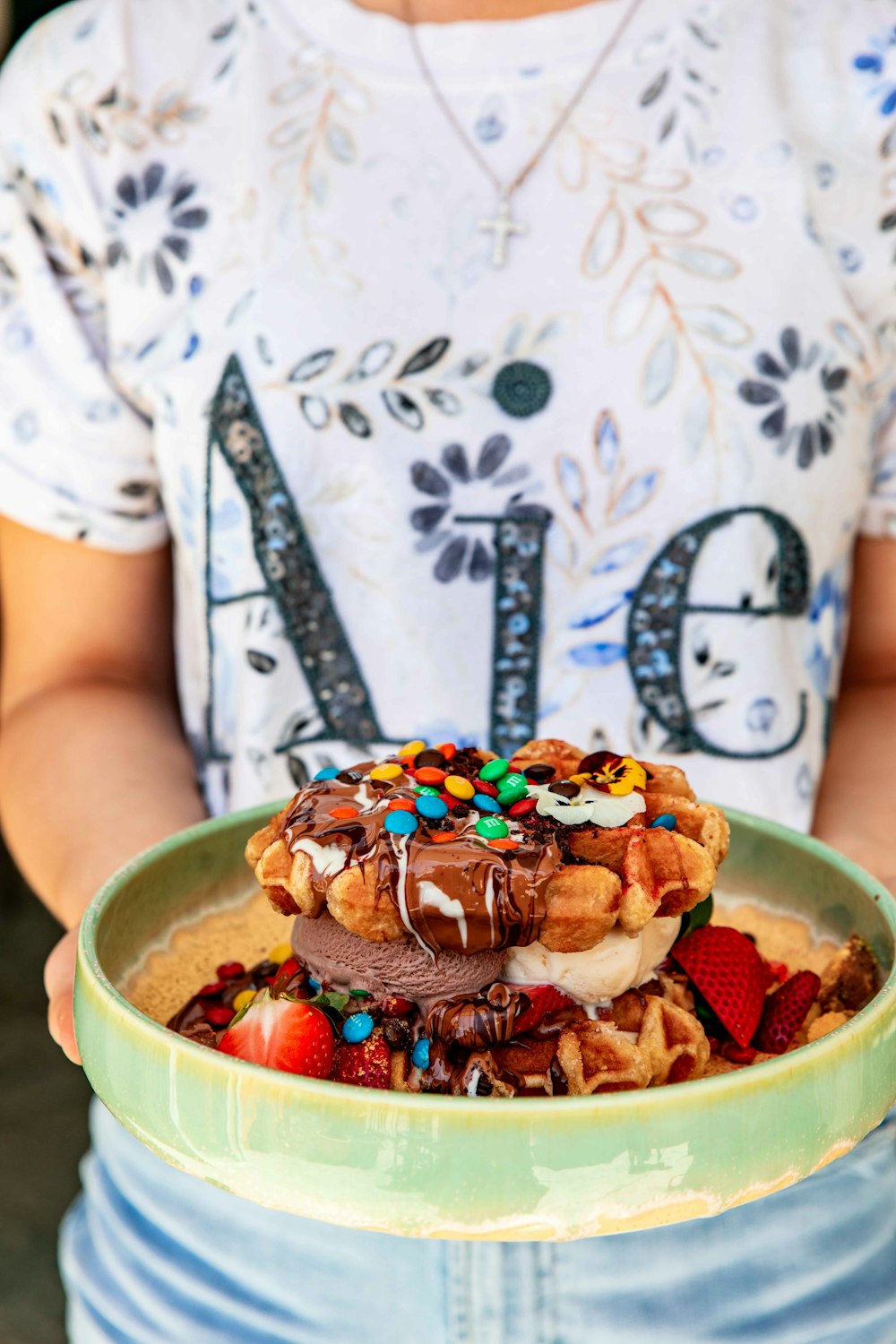 ice cream with chocolate syrup on green ceramic bowl