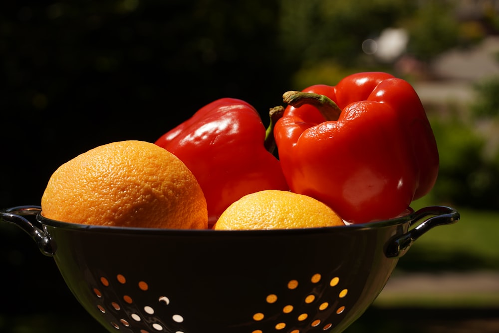 orange fruits in stainless steel bowl