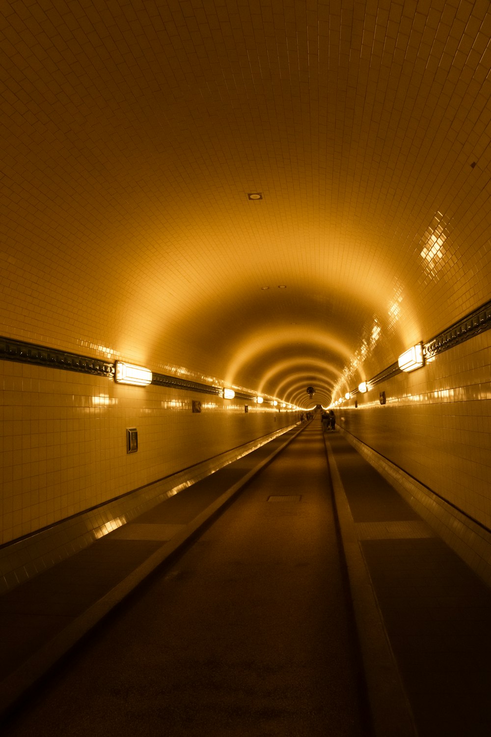 empty hallway with lights turned on in tunnel