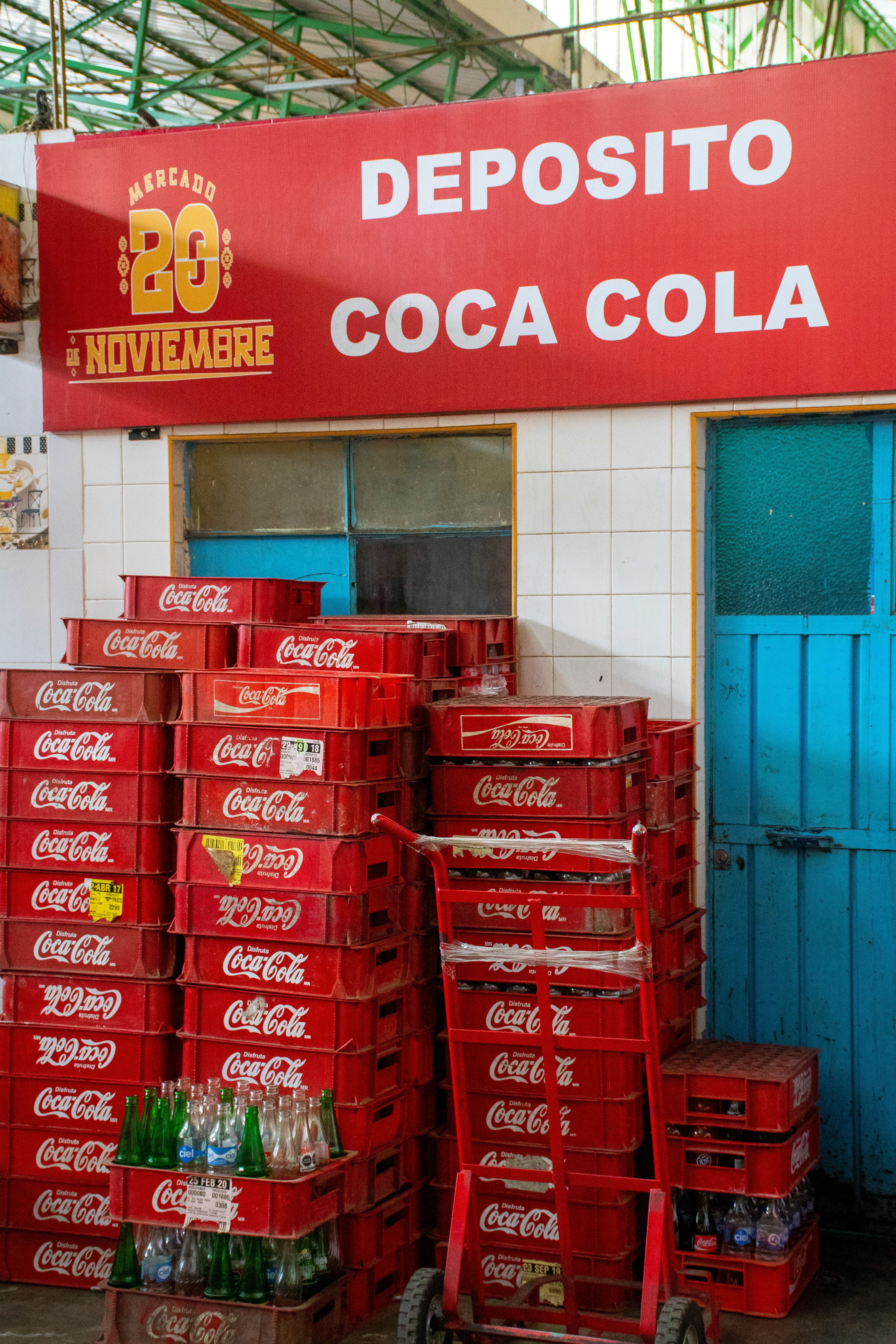 red coca cola boxes on shelf