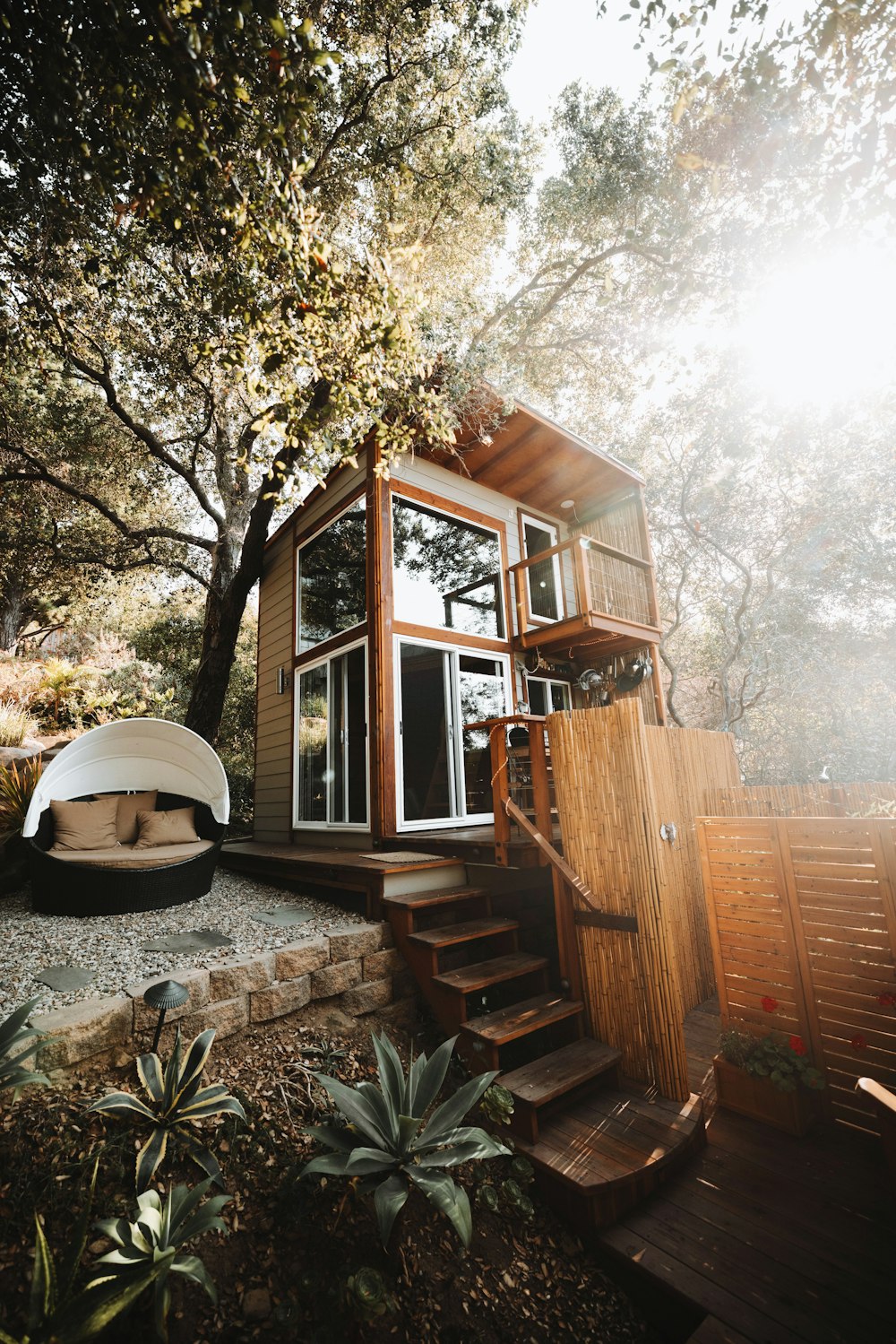 brown wooden house near trees during daytime