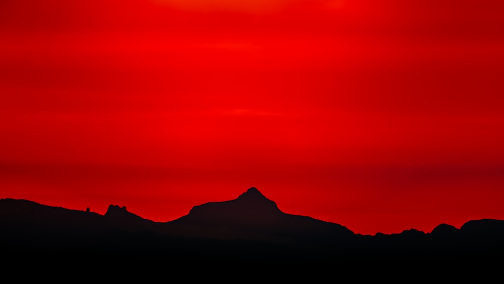 silhouette of mountain during sunset