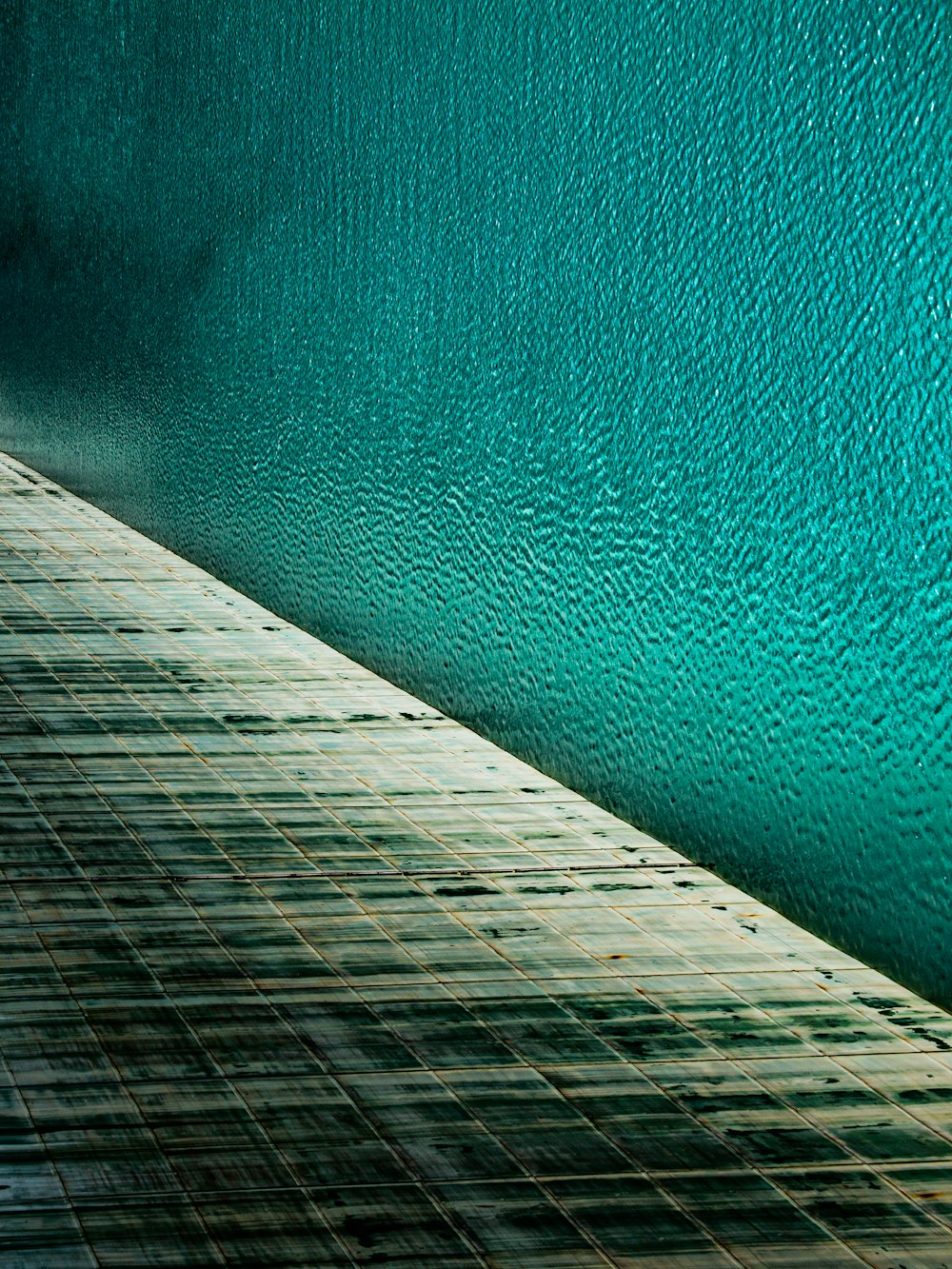 brown wooden dock over blue water