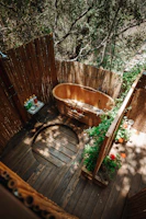 brown wooden round container on brown wooden fence