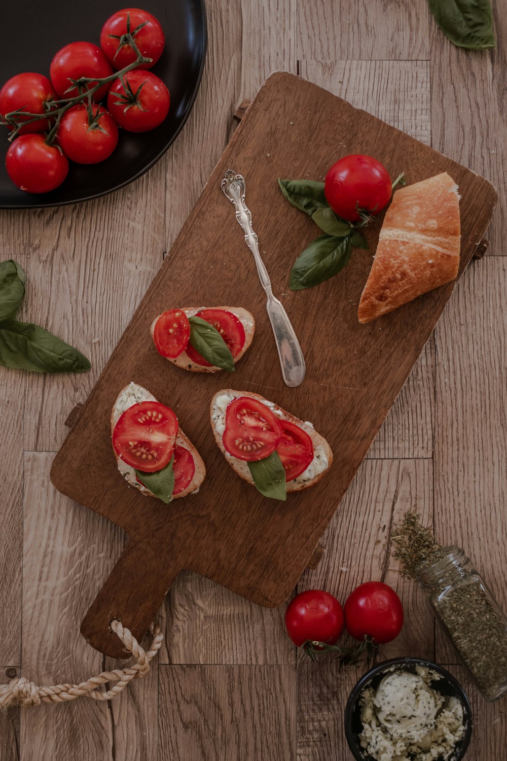 sliced tomato on brown wooden chopping board