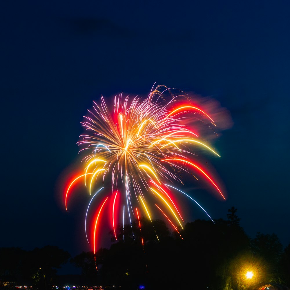 red and yellow fireworks during nighttime