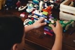 child playing with lego blocks