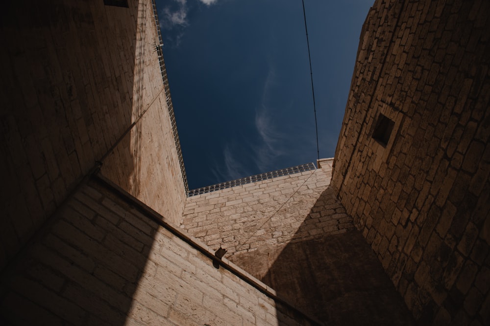 brown brick building under blue sky during daytime