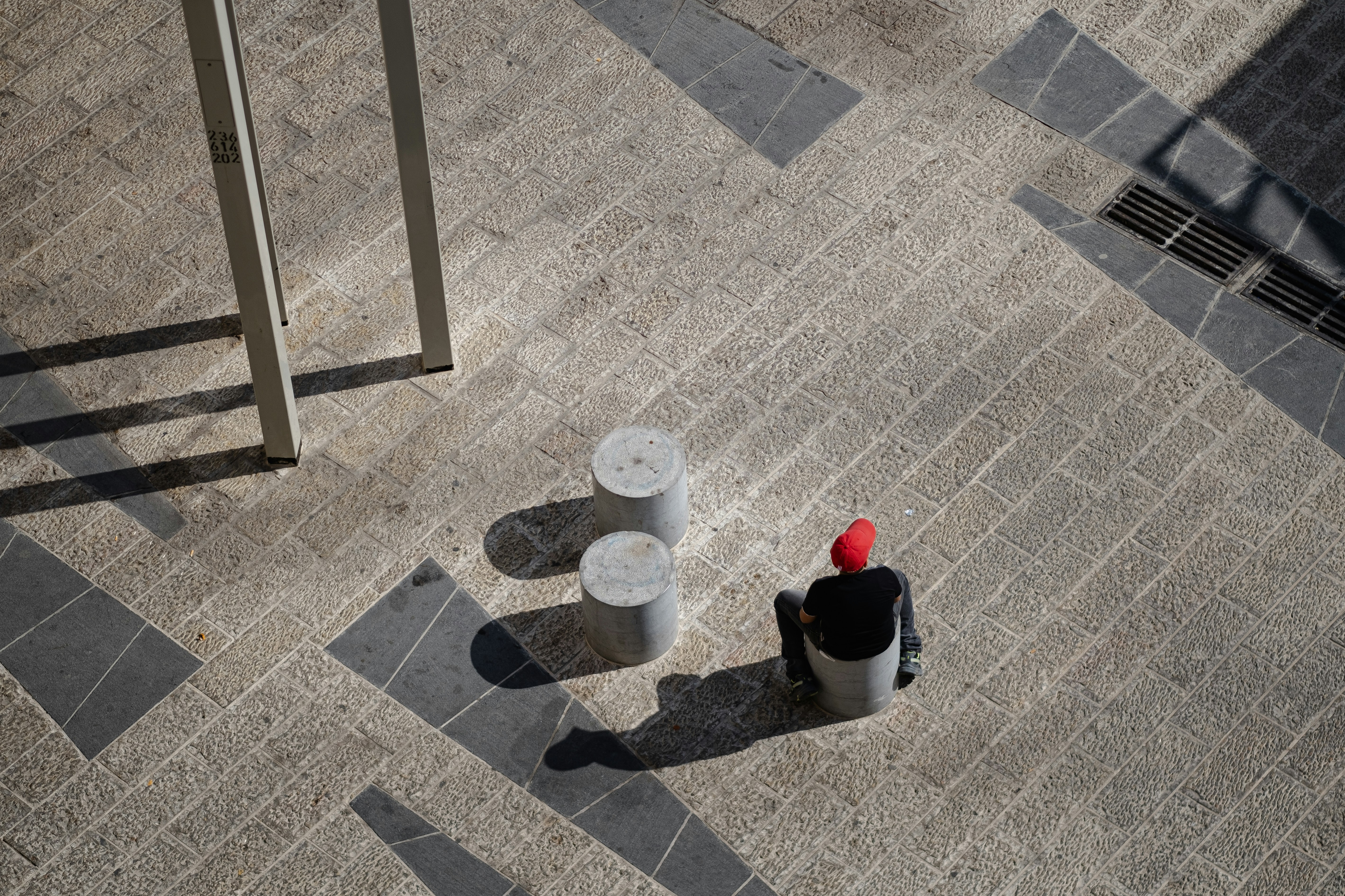 White and red plastic bucket on gray concrete floor